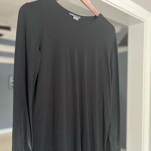 Long-sleeve dress top. End of sleeves gradient into a leather material.